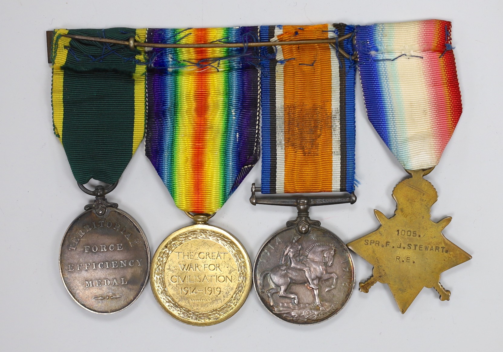 A WWI group of four including Territorial Force Efficiency Medal to 1005, SPR. F.J. STEWART. R.E.
